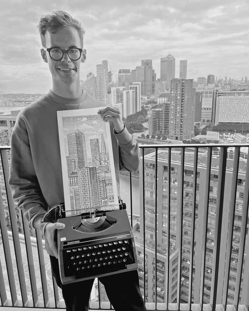6th june 2022 artist james cook stands on the balcony of an apartment building on london city island with his completed typewriter art