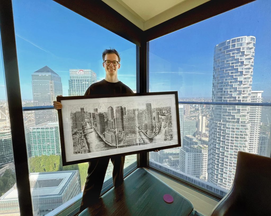 6th october 2022 artist james cook stands with his completed typewriter artwork 40 floors above london of canary wharf